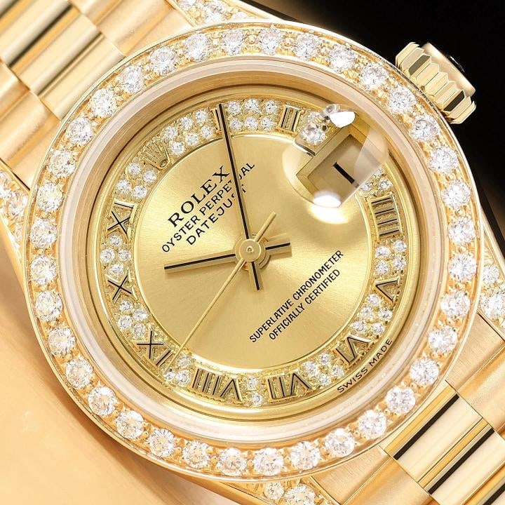ROLEX PRESIDENT 69178 CHAMPAGNE ROMAN FACTORY MYRIAD DIAMOND 18K GOLD WATCH: This is an authentic Rolex Datejust 69178 watch with Rolex 18K yellow gold president bracelet, Rolex factory roman myriad diamond dial, custom 18K yellow gold diamond bezel, added diamonds on the lugs