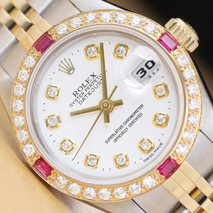 ROLEX LADIES DATEJUST 79173 WHITE DIAL 18K GOLD STEEL 2-TONE DIAMOND RUBY WATCH: This is an authentic Rolex Datejust 79173 no holes watch with Rolex 18K yellow gold and stainless steel jubilee bracelet, Rolex dial Ref. with added genuine diamond markers, and custom 18K yellow gold