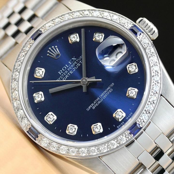 AUTHENTIC MENS ROLEX DATEJUST BLUE DIAMOND 18K WHITE GOLD STEEL WATCH: Condition: Pre-owned - Excellent,Bezel Color: Silver,Max Wrist Size: 7.26-7.5 in,Number of Jewels: 27 Jewels,Indices: Diamond Hour Marks, 12-Hour Dial,Bezel: Custom 18K White Gold Diamond & Sapphire B