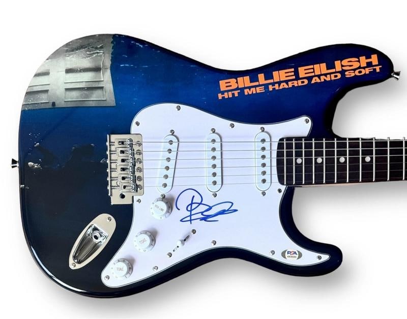 Billie Eilish Signed Guitar Custom Graphics PSA/DNA COA Hit Me Hard And Soft: Industry: Music,Signed: Yes,Autograph Authentication: James Spence (JSA),Object Type: Guitar & Guitar Pick,Original/Reproduction: Original,Country of Origin: United States Signer: Billie Eilish Item