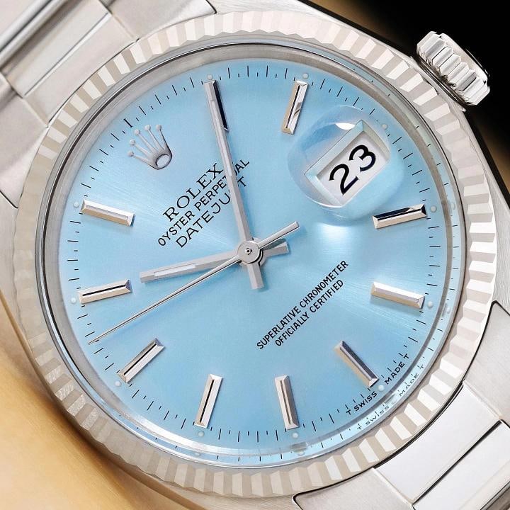 ROLEX MENS DATEJUST 16014 18K WHITE GOLD STEEL ICE BLUE DIAL OYSTER BAND WATCH: This is an authentic Rolex Datejust 16014 watch with Rolex stick dial Ref., Rolex 18K white gold fluted bezel, and custom stainless steel oyster band.. Descriptions: Brand: Rolex Model: Datejust