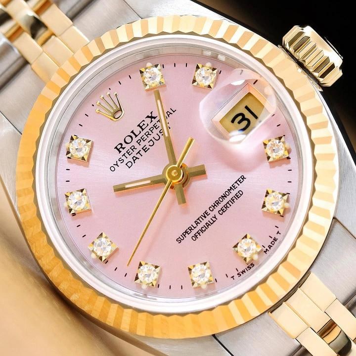 ROLEX LADIES DATEJUST 69173 PINK FACTORY DIAMOND DIAL 18K GOLD STEEL WATCH: This is an authentic Rolex Datejust 69173 watch with Rolex 18K yellow gold and stainless steel jubilee bracelet, factory Rolex diamond dial Ref., and Rolex 18K yellow gold fluted bezel. Descriptions: