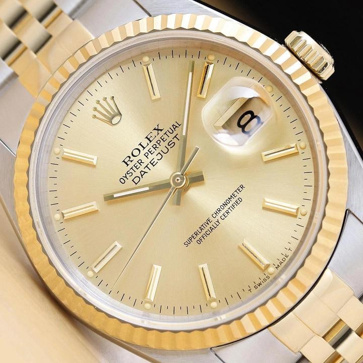 ROLEX MENS DATEJUST 16233 18K GOLD STAINLESS STEEL CHAMPAGNE DIAL TWO TONE WATCH: This is an authentic Rolex Datejust 16233 watch with original Rolex two tone 18K yellow gold and stainless steel jubilee bracelet, Rolex stick dial, and Rolex 18K yellow gold fluted bezel.