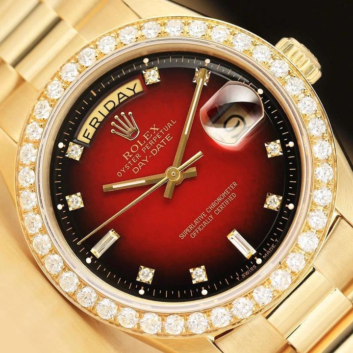 ROLEX MENS DAY-DATE PRESIDENT 2.0 CT BEZEL 18K GOLD RED VIGNETTE DIAMOND WATCH: This is an authentic Rolex Day-Date 1803 watch with custom 18K yellow gold president bracelet, Rolex dial (Ref.) with added diamond markers, custom 18K yellow gold 2.0 CT diamond bezel, and factory Ro