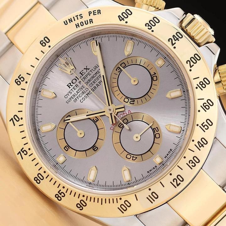 2003 PAPER ROLEX DAYTONA COSMOGRAPH 116523 GRAY 18K GOLD STEEL 40MM WATCH: This is an authentic Rolex Daytona Cosmograph 116523 40mm watch with chronograph gray dial, 18K yellow gold bezel, 18K yellow gold and stainless steel oyster bracelet, original Rolex paper and Rolex i