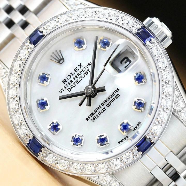 ROLEX LADIES DATEJUST 69174 M.O.P SAPPHIRE DIAMOND LUGS 18K WHITE GOLD/SS WATCH: Condition: Pre-owned - Excellent,Bezel Color: Silver,Max Wrist Size: 6.26-6.75 in,Number of Jewels: 29 Jewels,Indices: 12-Hour Dial, Seconds Hand, Sapphire Markers,Band: Rolex Stainless Steel Jubilee