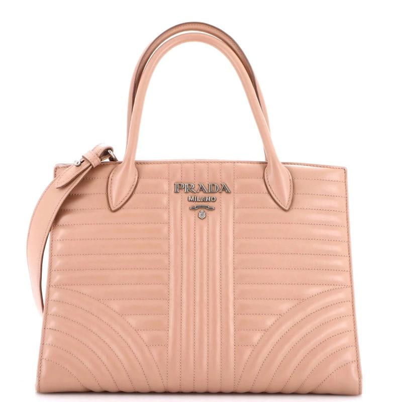 Prada Convertible Open Tote Diagramme Quilted Leather Medium: Accessories: With Strap Measurements: Handle Drop 6", Height 9", Width 12", Depth 6", Strap Drop 19".Condition: Pre-owned - Good,Brand: Prada,Exterior Material: Leather,Style: Totes,Exterior Color: