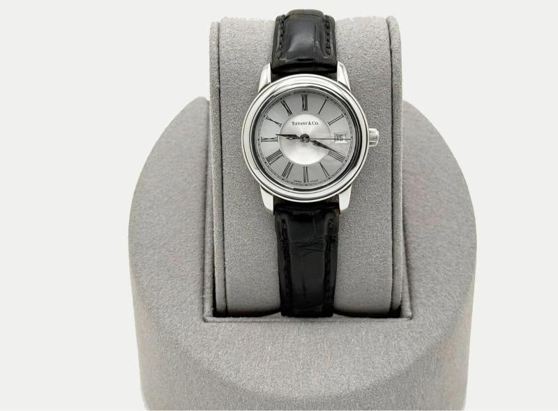 Tiffany & Co. Resonator 27mm Silver Dial Stainless Steel Watch: Condition: Pre-owned - Excellent,Country of Origin: Switzerland,Bezel Color: Silver,Movement: Mechanical (Automatic),,Dial Pattern: Silver,Indices: Roman Numerals,Band/Strap: Two-Piece Strap,Brand: