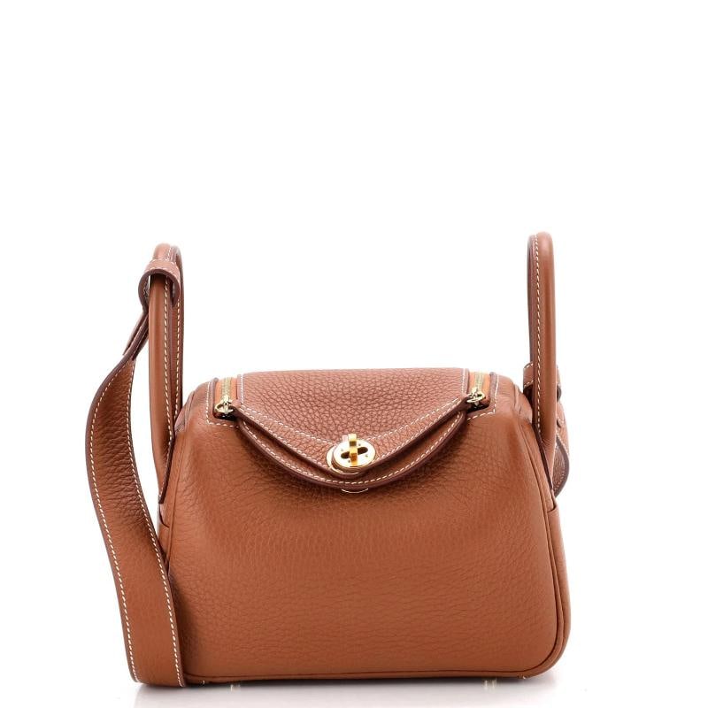 Hermes Lindy Bag Clemence Mini: Condition: Pre-owned - Excellent,Brand: Hermes,Exterior Material: Leather,Style: Cross Body Bags,Exterior Color: Brown,Department: Women,Size: Mini,Accessories: Dust Bag Condition: Pristine.
