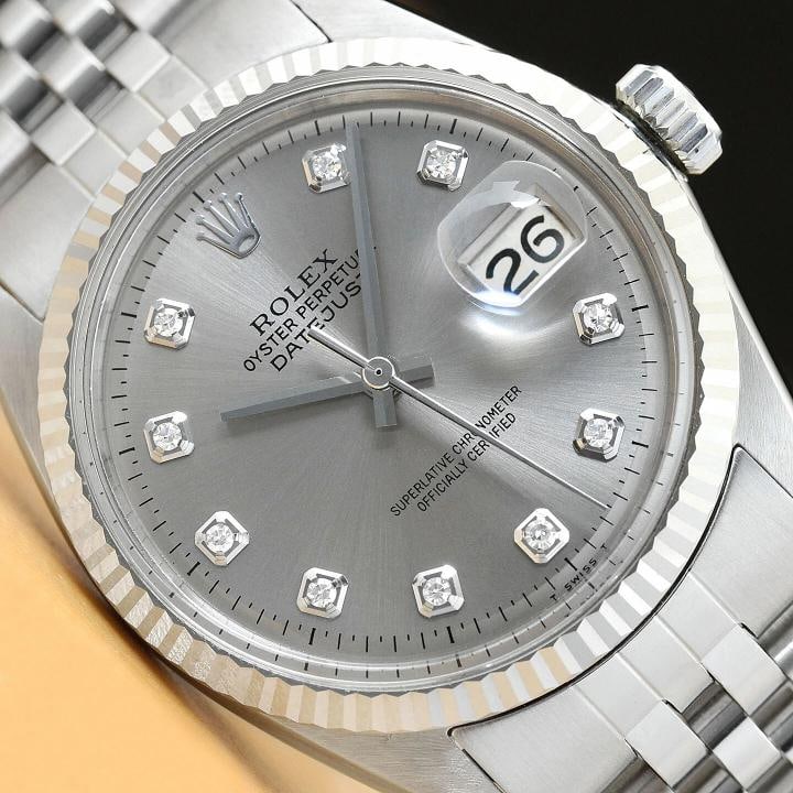MENS ROLEX DATEJUST 1601 GRAY DIAMOND DIAL 18K WHITE GOLD BEZEL STEEL WATCH: This is an authentic Rolex Datejust 1601 watch with Rolex 18K white gold fluted bezel, Rolex dial Ref. with added diamond hour markers, and custom stainless steel jubilee bracelet. Descriptions: Brand