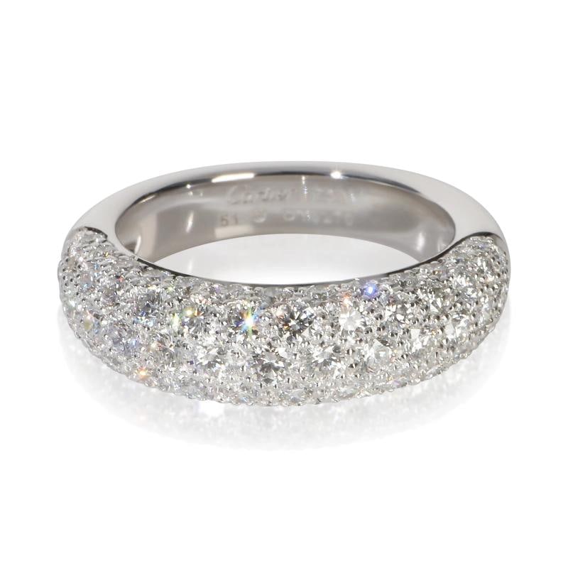 Cartier White Gold Diamond Mimi Star Ring: Condition: Pre-owned - Good,Shape: Round Brilliant,With Original Box/Packaging: Yes,Side Stone Type: Diamond,Side Stone Weight (cts): 0.15,Metal Purity: 18k,With Papers: No,Gross Weight (grams): 6.61,