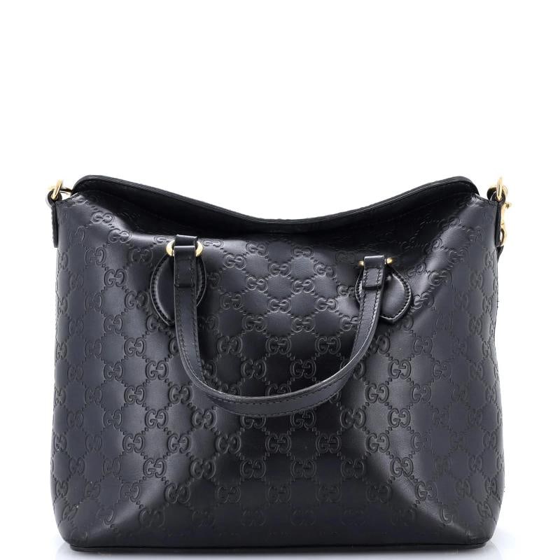Gucci Signature Fold Over Tote Guccissima Leather Medium: Condition: Pre-owned - Fair,Brand: Gucci,Exterior Material: Leather,Style: Top Handle,Exterior Color: Black,Department: Women,Size: Medium,Accessories: With Strap Estimated Retail Price: $1,790 Condit