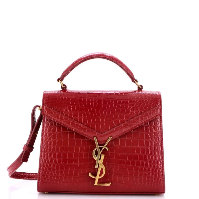 Saint Laurent Cassandra Top Handle Bag Crocodile Embossed Leather Mini: Accessories: With Strap Measurements: Handle Drop 2.5", Height 6.5", Width 8", Depth 3", Strap Drop 20". Condition: Pre-owned - Excellent,Brand: Saint Laurent,Exterior Material: Leather,Style: