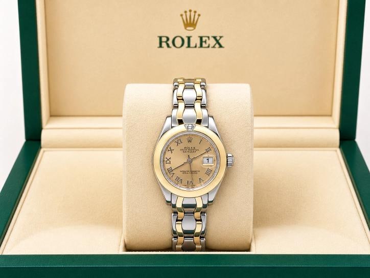 Rolex Datejust Pearlmaster 69329 29mm Champagne Roman Dial 18k Double Gold Box: Style Number: 69329 Year: 1995 Model: Rolex Datejust Pearlmaster Band: Double Gold - 18K Yellow Gold & 18k White Gold Bezel: 18K Yellow Gold with Diamond at the 12 O'Clock Dial: Champagne Roman