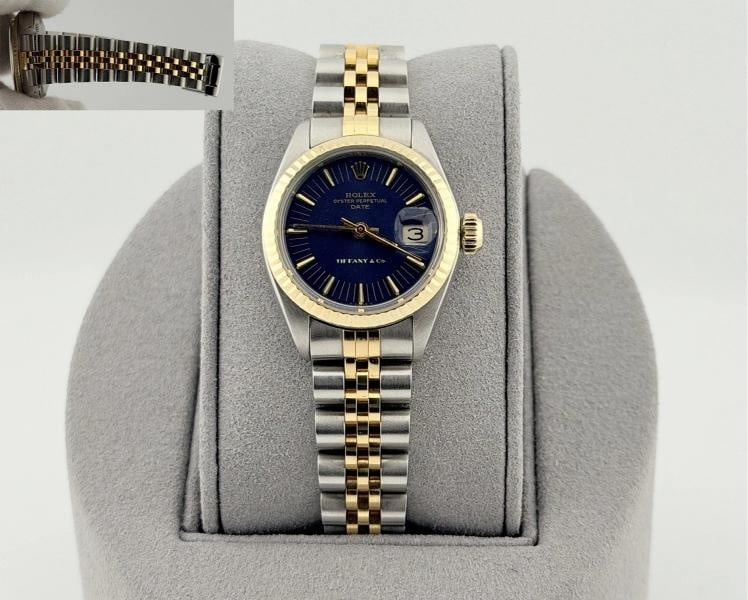 Rolex Ladies Date 6917 26mm Blue Tiffany & Co Stamped Dial 18k Yellow Gold Steel: Style Number: 6917 Serial: 367**** Year: 1974 Model: Rolex Ladies Date Case Material: Stainless Steel Band: 18k Yellow Gold & Stainless Steel Jubilee Bezel: 18k Yellow Gold Fluted Dial: Rare and
