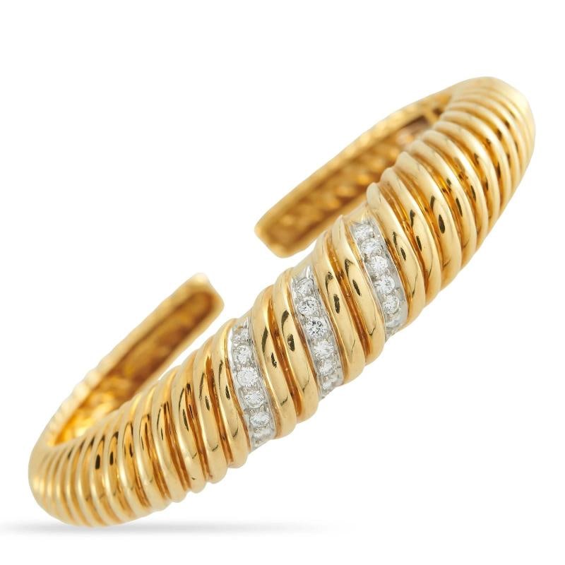 Tiffany & Co. Vintage 18K Yellow Gold 1.0ct Diamond Bracelet: Crafted from textured 18K Yellow Gold, Diamonds with a total weight of 1.0 carats allow it to effortlessly catch the light. It measures 7.0 long.. Condition: Pre-owned - Good: This item has been gentl