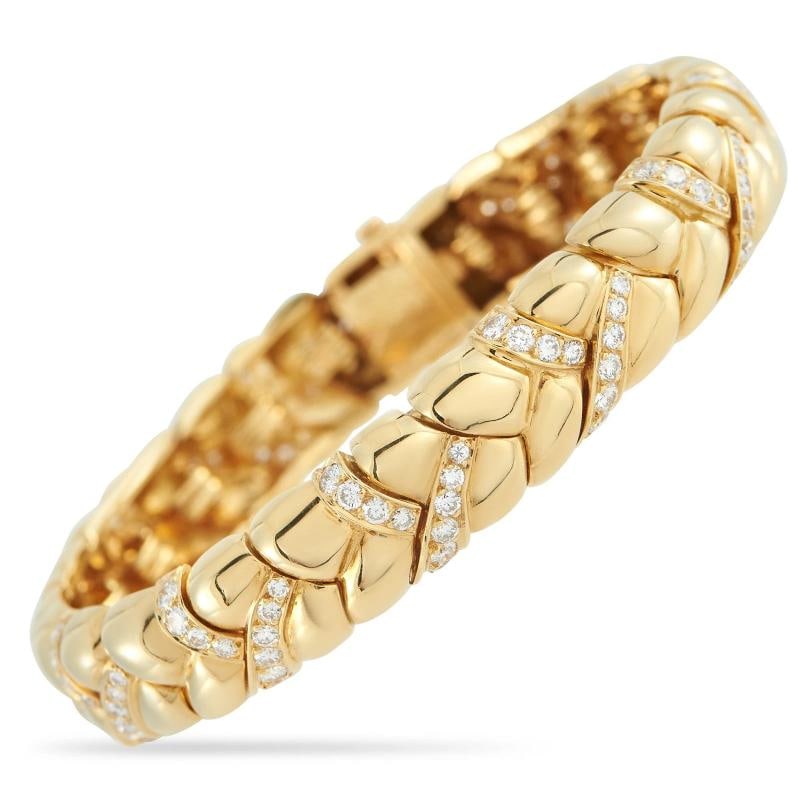 Van Cleef & Arpels Vintage 18K Yellow Gold Diamond Bracelet: . Diamonds with a total weight of 3.50 carats make it even more exquisite. It measures 7.0 long and includes secure tab insert clasp closure. Condition: Pre-owned - Good: This item has been gently use