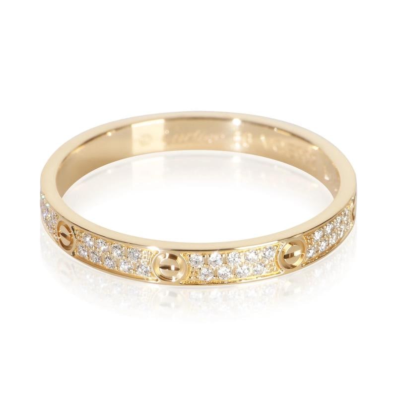 Cartier Yellow Gold Diamond Mini Model Love Ring: Condition: Pre-owned - Good,Shape: Round Brilliant,Side Stone Type: Diamond,Side Stone Weight (cts): 0.19,Metal Purity: 18k,With Original Box/Packaging: No,With Papers: No,Gross Weight (grams):