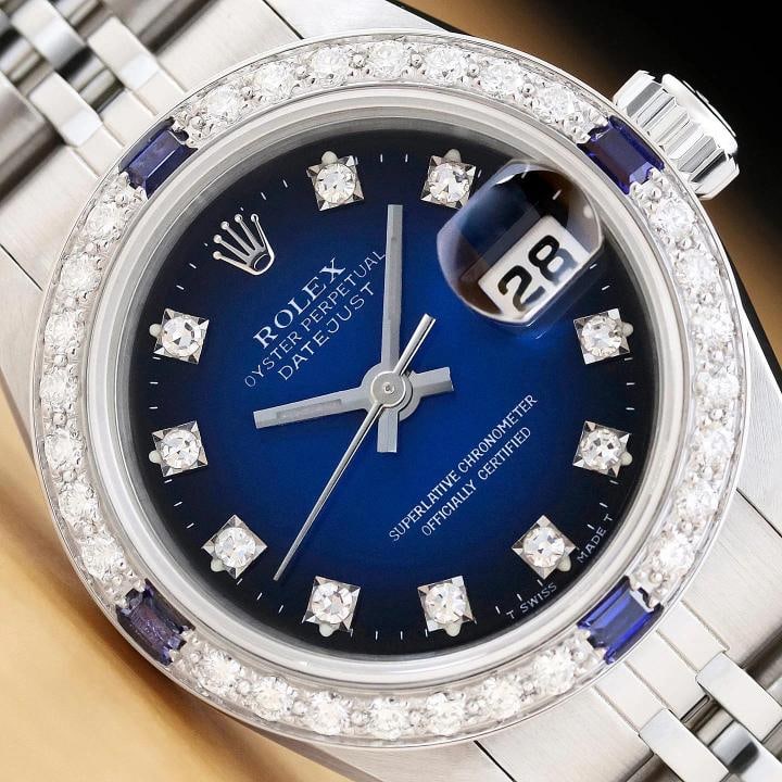 ROLEX DATEJUST 69174 18K WHITE GOLD STEEL BLUE VIGNETTE DIAMOND SAPPHIRE WATCH: Condition: Pre-owned - Excellent,Bezel Color: Silver,Max Wrist Size: 6.26-6.75 in,Number of Jewels: 29 Jewels,Indices: Diamond Markers, 12-Hour Dial,Band: Rolex Stainless Steel Jubilee Bracelet,Bezel: