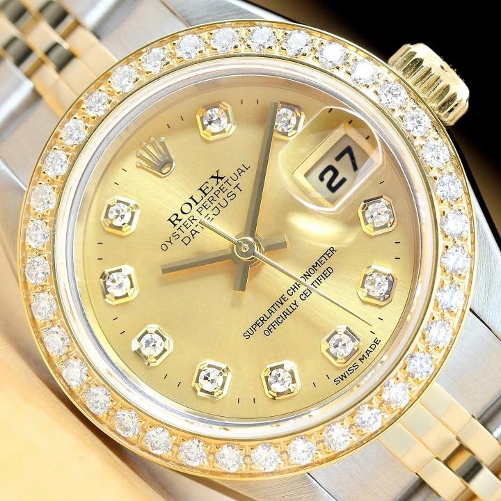 ROLEX LADIES DATEJUST 79173 CHAMPAGNE 18K YELLOW GOLD DIAMOND STEEL WATCH: This is an authentic Rolex Datejust 79173 watch with Rolex 18K yellow gold stainless steel jubilee bracelet, Rolex dial Ref. with added genuine diamond markers, and custom 18K yellow gold diamond