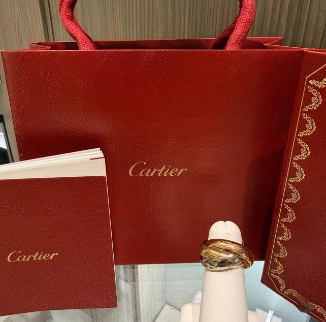 Cartier Large Model Trinity Ring 18kt Tri-Color Gold Size 52/US 6 (2016): Condition: Pre-owned - Good,Ring Size: 6,Brand: Cartier,Type: Ring,Shape: Round,Metal Purity: 18k,Color: Multicolor,Collection: Cartier Trinity,Style: Band,Material: Metal,Metal: Multi-Tone Gold,Main 