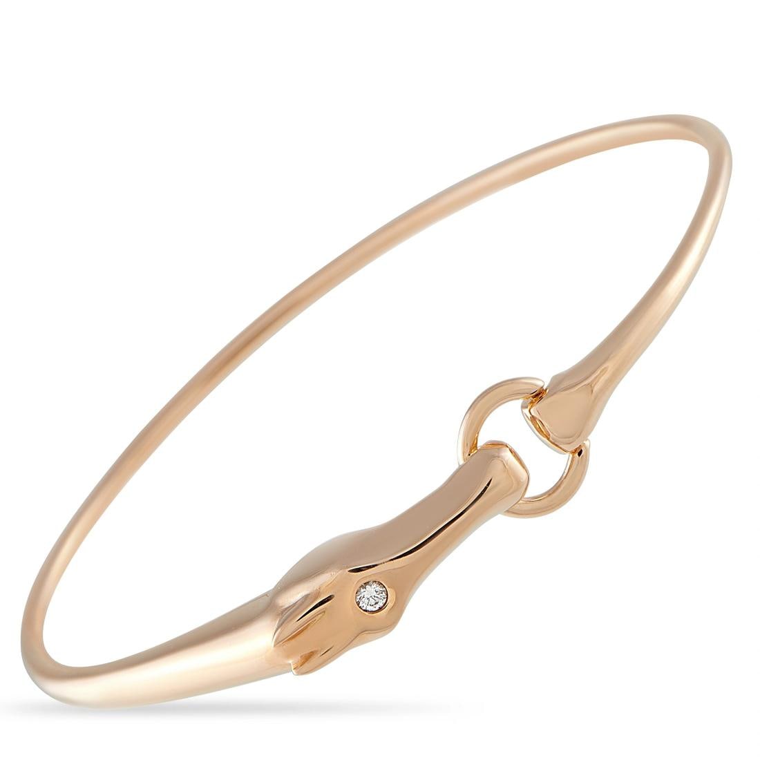 Hermes Herms Galop 18K Rose Gold Diamond Bracelet: crafted in 18K rose gold as a hinged bangle with hoof-shaped terminals joined by a loop clasp set with a single 0.03 carat diamond accent. It fits an average wrist (approximately 6.25 inches) and weig