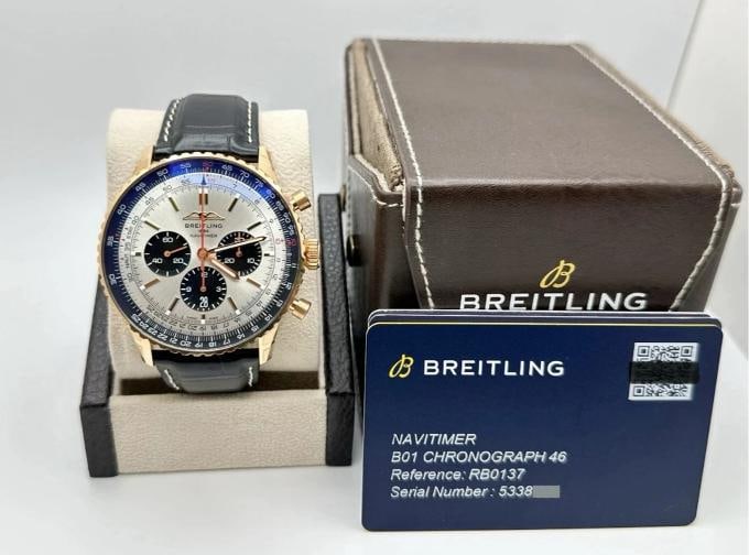 2024 Breitling Navitimer B01 RB0137 46mm Chronograph 18K Gold Box Paper Stickers: Style Number: RB0137 Serial: 5338*** Model: Breitling Navitimer B01 Chronograph Case Material: 18K Rose Gold Band: Black Leather Bezel: 18k Rose Gold Dial: Silver with Black Sub Dials Crystal: Sapphir