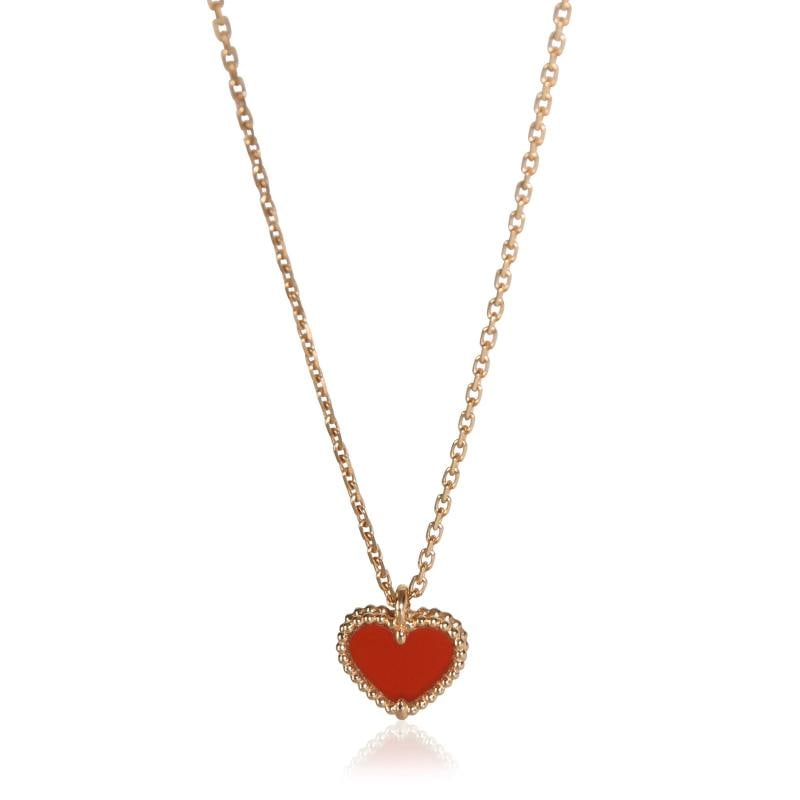 Van Cleef & Arpels Rose Gold Carnelian Sweet Hearts Pendant: Condition: Pre-owned,Clasp/Buckle Type: Lobster Claw,With Papers: Yes,Side Stone Type: No Stone,Main Stone: Carnelian,Metal Purity: 18k,With Original Box/Packaging: No,Gross Weight (grams): 2.74,Depar