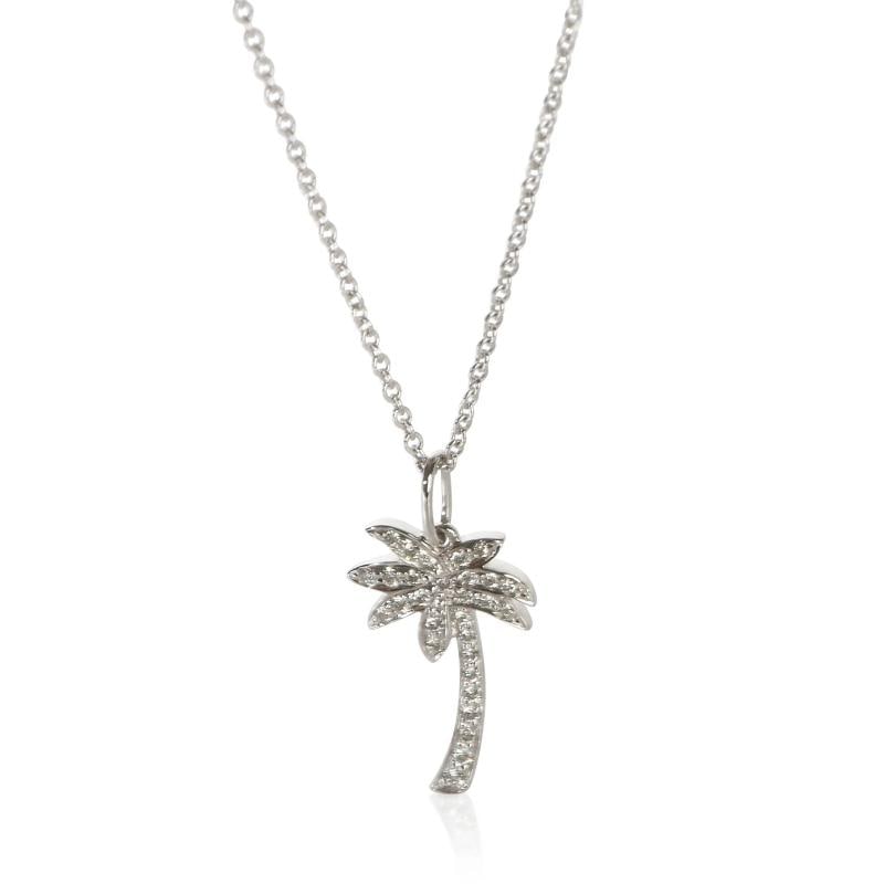 Tiffany & Co. Platinum Diamond Palm Tree Pendant: Condition: Pre-owned,Clasp/Buckle Type: Spring Ring,Side Stone Type: Diamond,Side Stone Weight (cts): 0.09,Metal Purity: 950,With Original Box/Packaging: No,With Papers: No,Gross Weight (grams): 3.19,