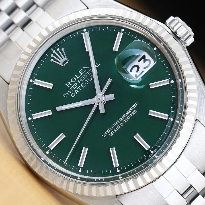 ROLEX MENS DATEJUST GREEN DIAL 18K WHITE GOLD STEEL WATCH w/ JUBILEE BAND: This is an authentic Rolex Datejust 1601 watch with Rolex 18K white gold fluted bezel, Rolex stick refinished dial (Ref.), and custom stainless steel jubilee bracelet. Descriptions: Brand: Rolex Model