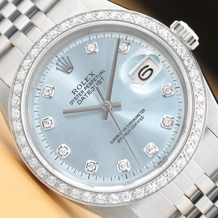 MENS ROLEX DATEJUST ICE BLUE 18K WHITE GOLD DIAMOND & STAINLESS STEEL WATCH: This is an authentic Rolex Datejust 1603 watch with Rolex dial Ref. with added diamond hour markers, custom 18K white gold diamond bezel, and custom stainless steel jubilee bracelet. Descriptions: