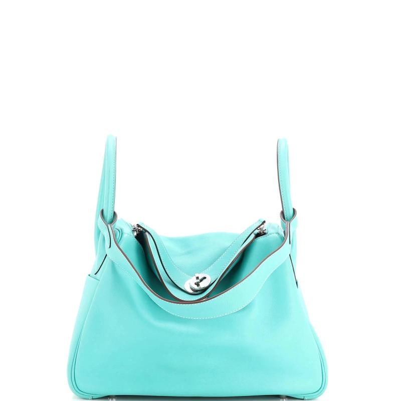 Hermes Lindy Bag Swift 30: Condition: Pre-owned - Good,Brand: Hermes,Exterior Material: Leather,Style: Shoulder Bags,Exterior Color: Blue,Department: Women,Size: 30 Estimated Retail Price: $7,850 Condition: Very Good. Exterior: