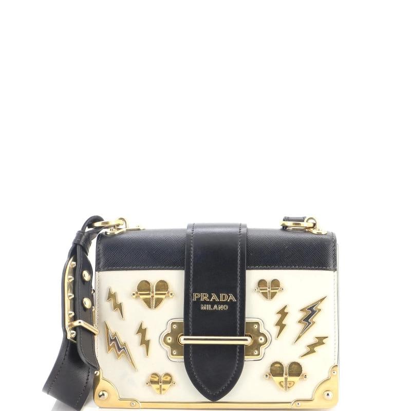 Prada Cahier Crossbody Bag Embellished Leather Small: Accessories: Dust Bag, With Strap Measurements: Height 5", Width 8", Depth 3", Strap Drop 17.5-21.5". Condition: Pre-owned - Good,Brand: Prada,Exterior Material: Leather,Style: Cross Body