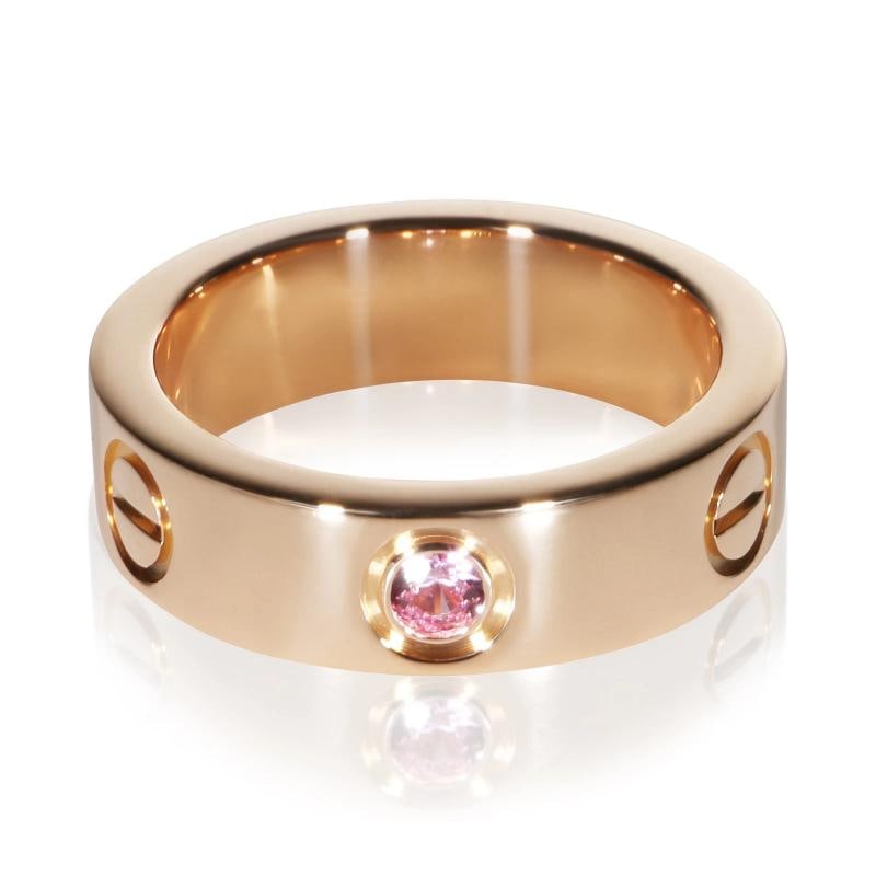 Cartier Rose Gold Pink Sapphire Love Ring: Condition: Pre-owned,Side Stone Type: Pink Sapphire,Metal Purity: 18k,With Original Box/Packaging: No,With Papers: No,Gross Weight (grams): 8.82,Department: Women's,Collection: Love,Type: Ring,Main St