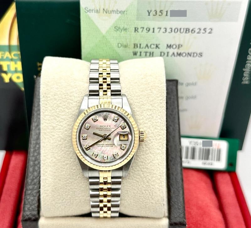 2002 Rolex Ladies Datejust 79173 Black MOP Diamond Dial Steel 18k Gold Box Paper: Condition: Pre-owned - Excellent,Bezel Color: Gold, Yellow,Dial Pattern: Mother of Pearl,Indices: Diamond Markers,Year Manufactured: 2000-2009,Band/Strap: Rolex Jubilee,Case Color: Silver,Department: