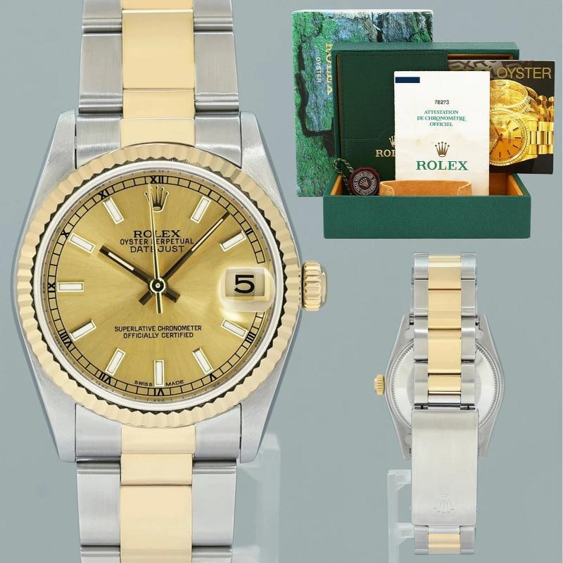 2003 PAPERS MINT Ladies Rolex 78273 Two Tone 31mm Champagne Stick Oyster Watch: Case & Dial Case Material: Rolex Two-Tone Yellow Gold & Stainless Steel Case Size: 31mm Bezel: Rolex Yellow Gold Fluted Crystal: Rolex Sapphire Dial: Rolex Champagne Movement & Bracelet Movement: Role