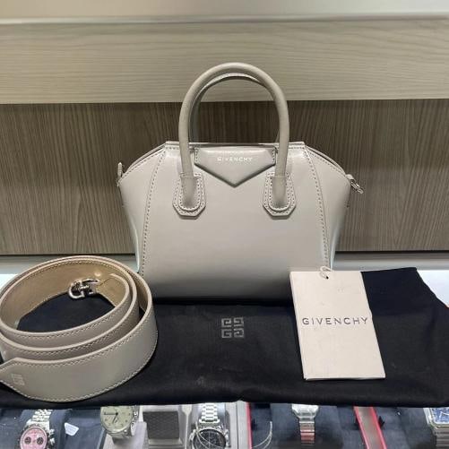 Givenchy Antigona Toy Bag in Light Grey Box Leather: Condition: Pre-owned - Good,Bag Width: 8.66 in,Closure: Magnetic,Size: Mini,Hardware Color: Silver,Bag Depth: 3.94 in,Accents: Strap Accent,Vintage: No,Accessories: Dust Bag, With Strap,Department: