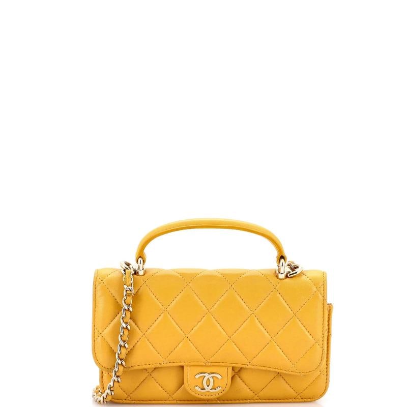 Chanel Classic Top Handle Flap Phone Holder with Chain Quilted Lambskin: Measurements: Height 4", Width 6.5", Depth 1.5" . Condition: Pre-owned - Good,Brand: Chanel,Exterior Material: Leather,Style: Cross Body Bags,Exterior Color: Yellow,Department: Women,Size: Unknown