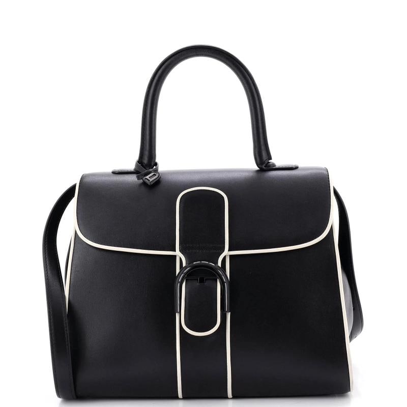 Delvaux Brillant Top Handle Bag Leather MM: Accessories: Mirror, Charms, With Strap Measurements: Handle Drop 4.5", Height 8.5", Width 11", Depth 6", Strap Drop 14.5-20". Condition: Pre-owned - Good,Brand: Delvaux,Exterior Material: