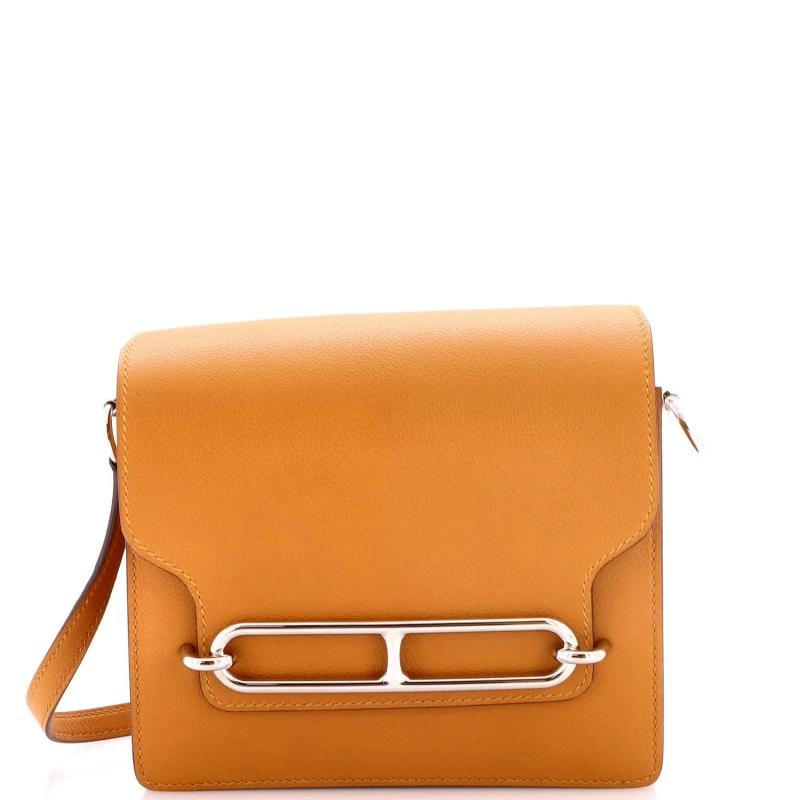 Hermes Roulis Bag Verso Evercolor 18: Condition: Pre-owned - Excellent,Brand: Hermes,Exterior Material: Leather,Style: Cross Body Bags,Exterior Color: Brown,Department: Women,Size: 18,Accessories: Dust Bag, With Strap Condition:
