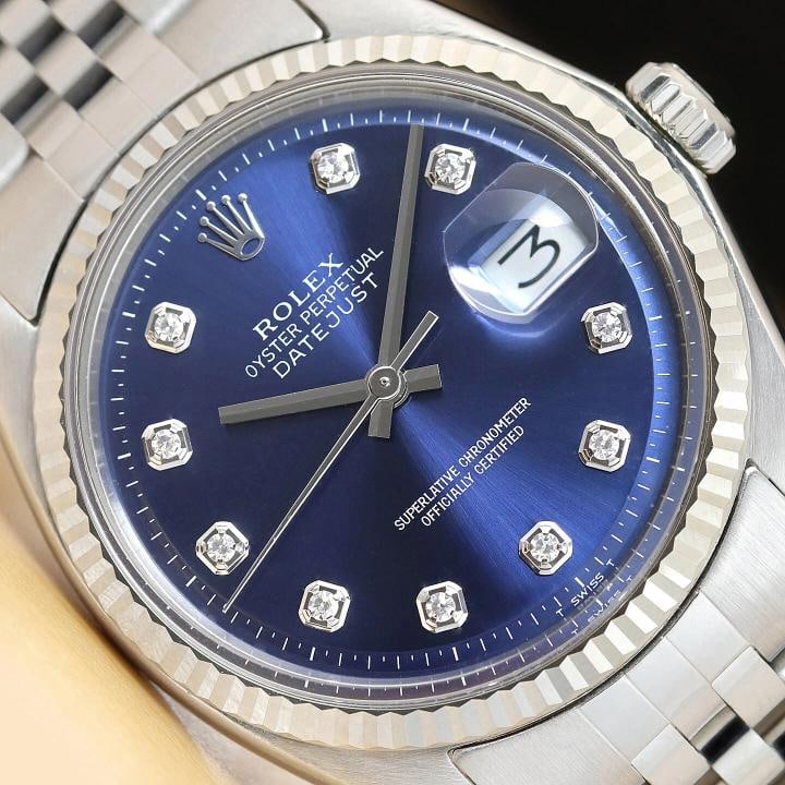 MENS ROLEX DATEJUST 18K WHITE GOLD STAINLESS STEEL BLUE DIAMOND DIAL 1601 WATCH: This is an authentic Rolex Datejust 1601 watch with Rolex 18K white gold fluted bezel, custom stainless steel jubilee bracelet, and Rolex dial Ref. with added genuine diamond markers.. Descriptions: B