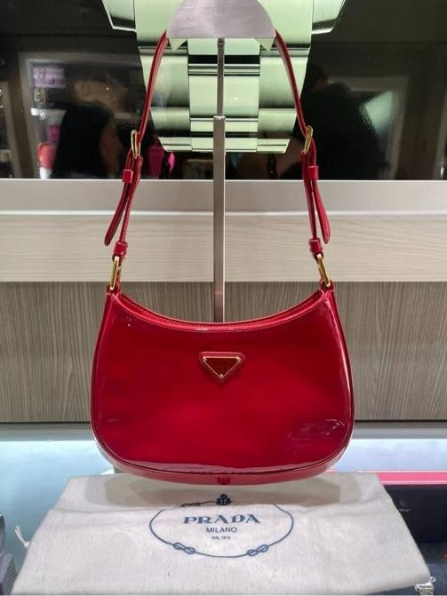 Prada Cleo Bag Red Patent Leather: Condition: Pre-owned - Excellent,Brand: PRADA,Department: Women,Exterior Color: Red,Model: Prada Cleo,Style: Shoulder Bag,Exterior Material: Patent leather,Handle/Strap Material: Patent Leather,Countr