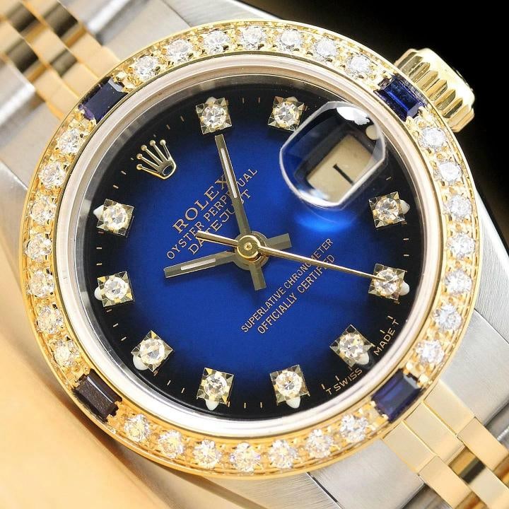 ROLEX LADIES DATEJUST FACTORY DIAL DIAMOND SAPPHIRE BEZEL 18K GOLD SS WATCH: Condition: Pre-owned - Excellent,Bezel Color: Gold,Max Wrist Size: 6.26-6.75 in,Number of Jewels: 29 Jewels,Indices: Diamond Markers, 12-Hour Dial,Band: Rolex Two Tone Jubilee Bracelet,Bezel: Custom