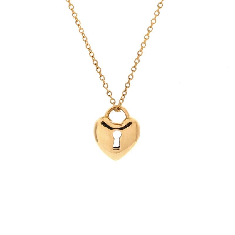 Tiffany & Co. Heart Lock Pendant Necklace 18K Yellow Gold: Condition: Pre-owned - Good,Brand: Tiffany & Co.,Main Stone: Unknown,Metal: 18K Yellow Gold,Metal Purity: 18K,Style: Pendant,Type: Necklace,Color: Yellow Gold,Material: 18K Yellow Gold Estimated