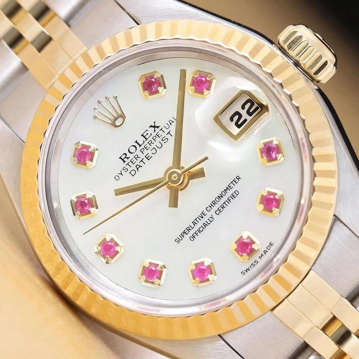 ROLEX LADIES DATEJUST 79173 MOTHER OF PEARL RUBY DIAL 18K GOLD SS TWO TONE WATCH: This is an authentic Rolex Datejust 79173 no holes watch with Rolex 18K yellow gold and stainless steel jubilee bracelet, Rolex dial Ref. with added mother of pearl and ruby markers, and Rolex 18K yel