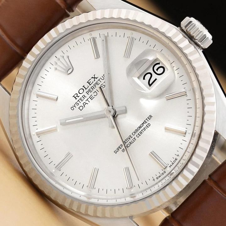 ROLEX MENS DATEJUST 16014 18K GOLD STEEL SILVER DIAL BROWN LEATHER BAND WATCH: This is an authentic Rolex Datejust 16014 watch with Rolex stick dial Ref., Rolex 18K white gold fluted bezel, and custom genuine brown leather strap. Descriptions: Brand: Rolex Model: Datejust
