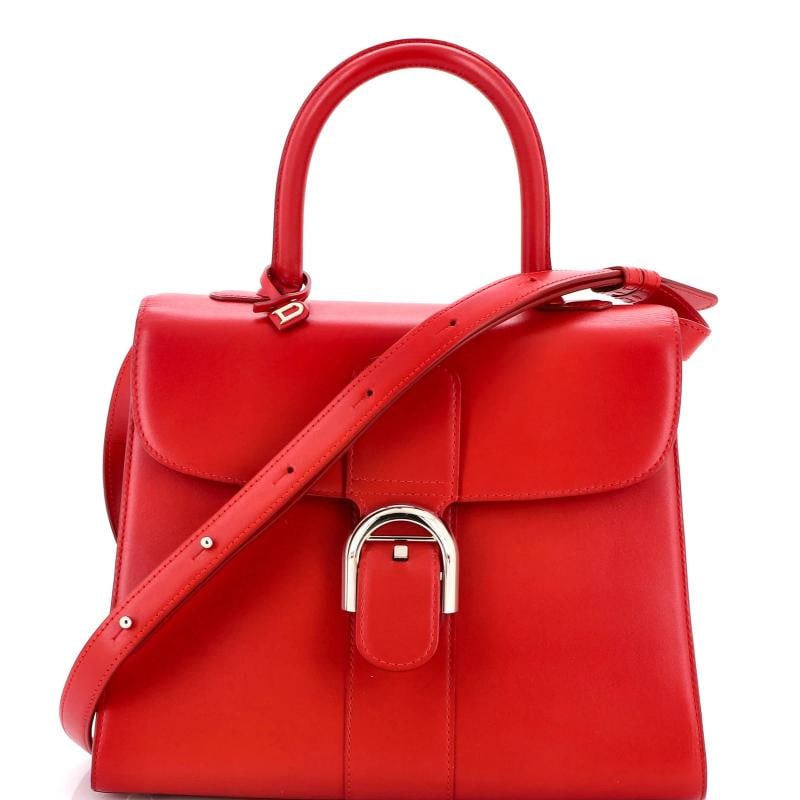 Delvaux Brillant Top Handle Bag Leather MM: Accessories: Charms, With Strap Measurements: Handle Drop 4.5", Height 8.5", Width 11", Depth 6", Strap Drop 14.5-20" . Condition: Pre-owned - Good,Brand: Delvaux,Exterior Material: Leather,Style:
