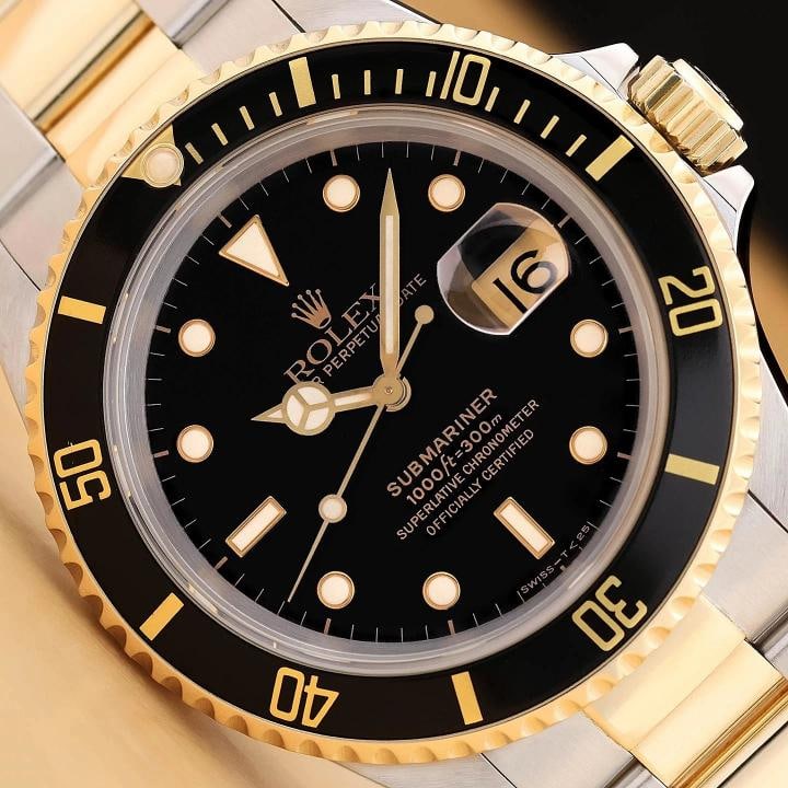 ROLEX SUBMARINER DATE 16613LN 40MM 18K YELLOW GOLD STEEL BLACK WATCH w/ PAPER: This is an authentic Rolex Submariner Date 16613 LN 40mm black dial watch with black rotatable 18K yellow gold bezel, 18K yellow gold and stainless steel oyster bracelet, and original Rolex paper. Des