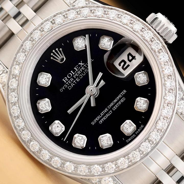 ROLEX LADIES DATEJUST 69174 BLACK DIAMOND 18K GOLD STEEL DIAMOND LUGS WATCH: This is an authentic Rolex Datejust 69174 watch with Rolex stainless steel jubilee bracelet, Rolex dial Ref. with added diamond markers, custom 18K white gold diamond bezel, and added diamond on the