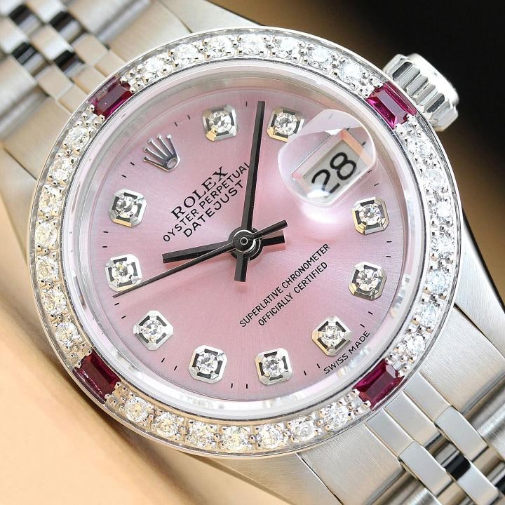 ROLEX LADIES DATEJUST 69174 PINK RUBY DIAMOND 18K GOLD STAINLESS STEEL WATCH: This is an authentic Rolex Datejust 69174 watch with Rolex stainless steel jubilee band, Rolex dial Ref. with added genuine diamond markers, and custom 18K white gold diamond ruby bezel.
